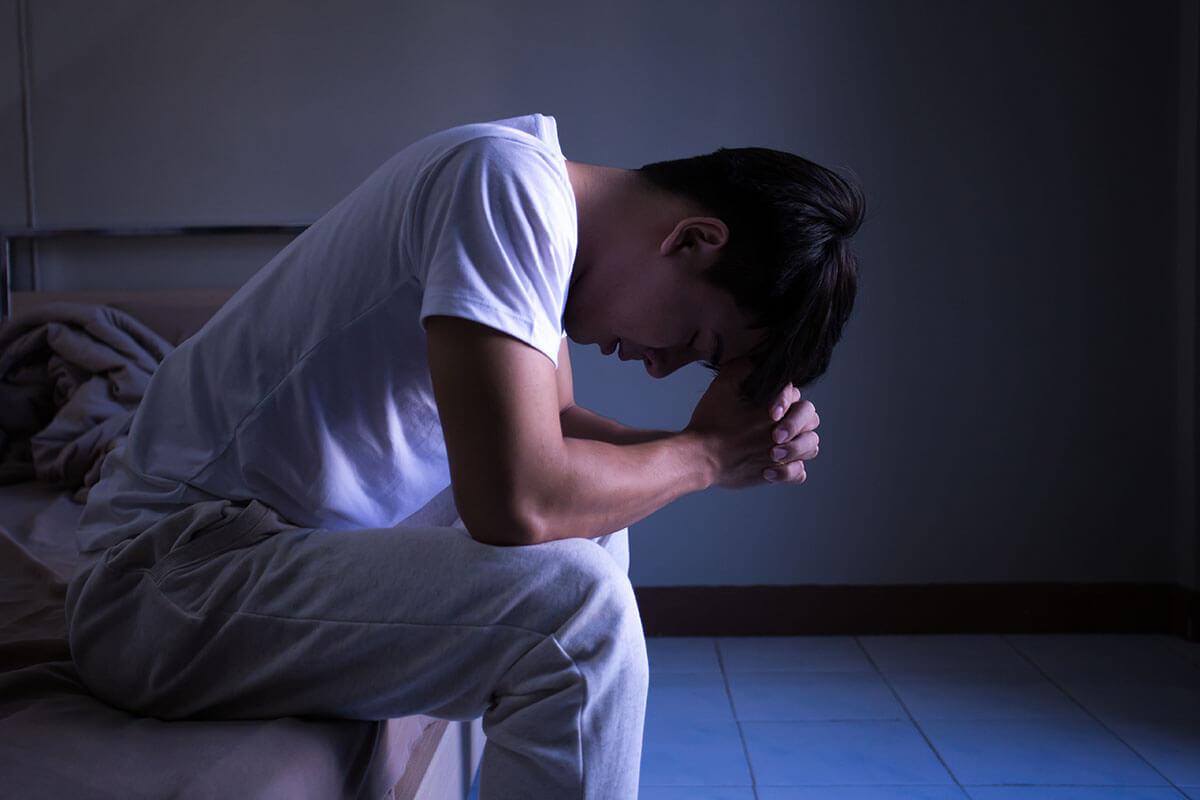 depressed man in isolation needing Depression Treatment During the Coronavirus Pandemic