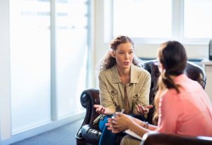 woman discussing TMS Therapy Near Brandon FL with therapist