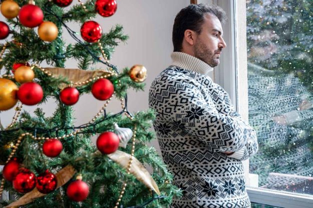 man struggling with depression during christmas